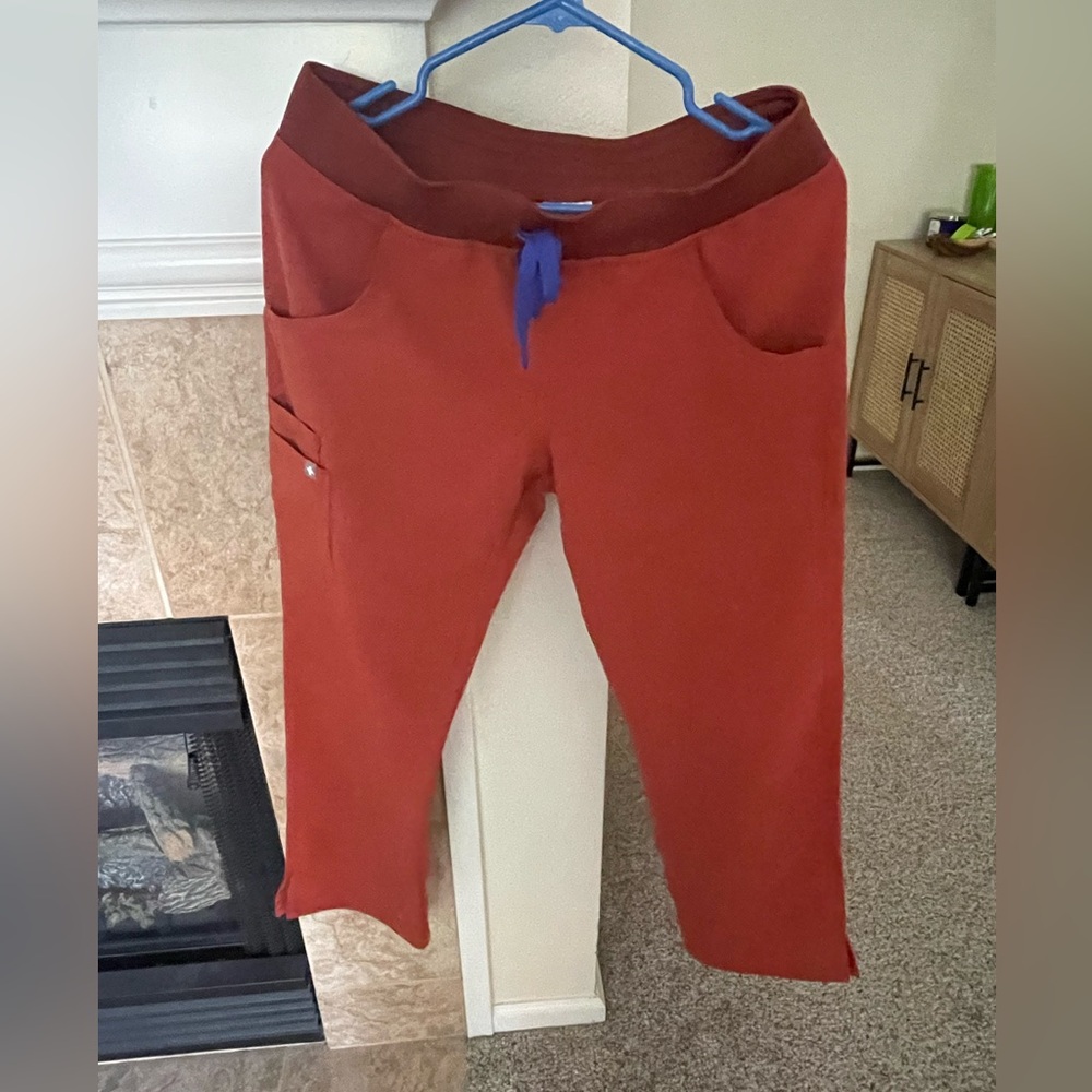 Rust orange Figs scrub pants, size S.
